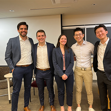 Five people from project team standing together.