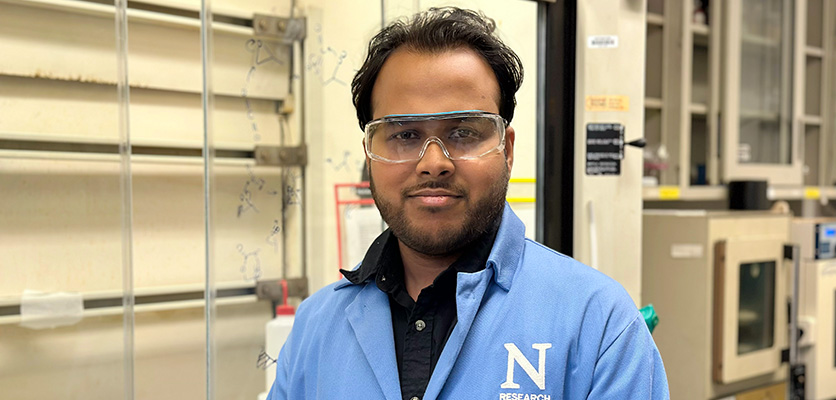 Krishanu Dey in a lab wearing a lab coat