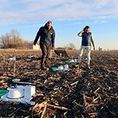 researchers on farm field