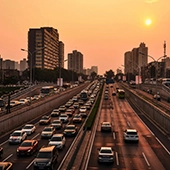 cars on an expressway at sunset