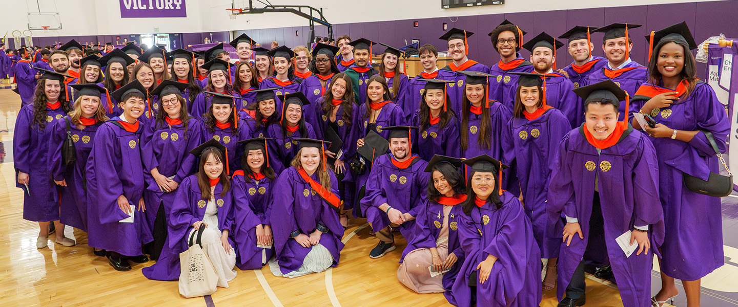 Group of MSES graduates in caps and gowns