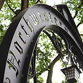 northwestern arch close up - black metal arch with northwestern university punched out in a gothic font