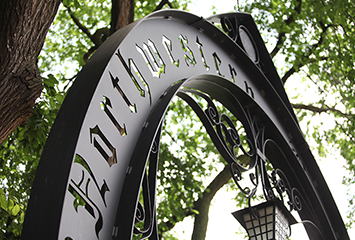 northwestern university arch - black and metal arch with northwestern university punched out in a gothic font