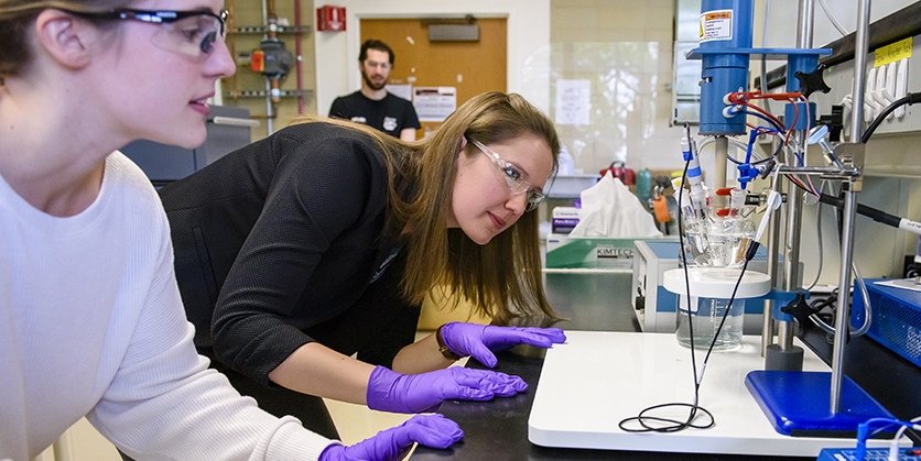 faculty member Linsey Seitz in the lab with an assistant
